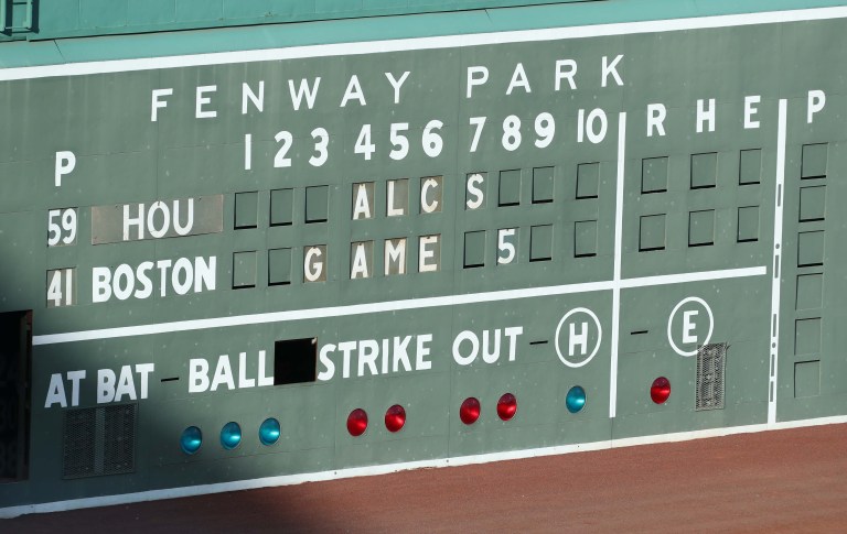 Chaos reigns after line drive gets stuck in light fixture on Green Monster scoreboard