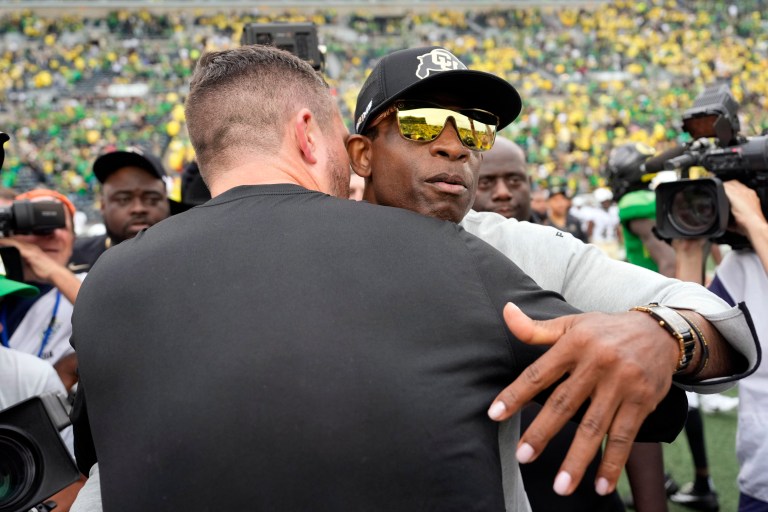 Deion Sanders, Dan Lanning exchange quick handshake after Ducks demolish Buffs in Eugene [VIDEO]