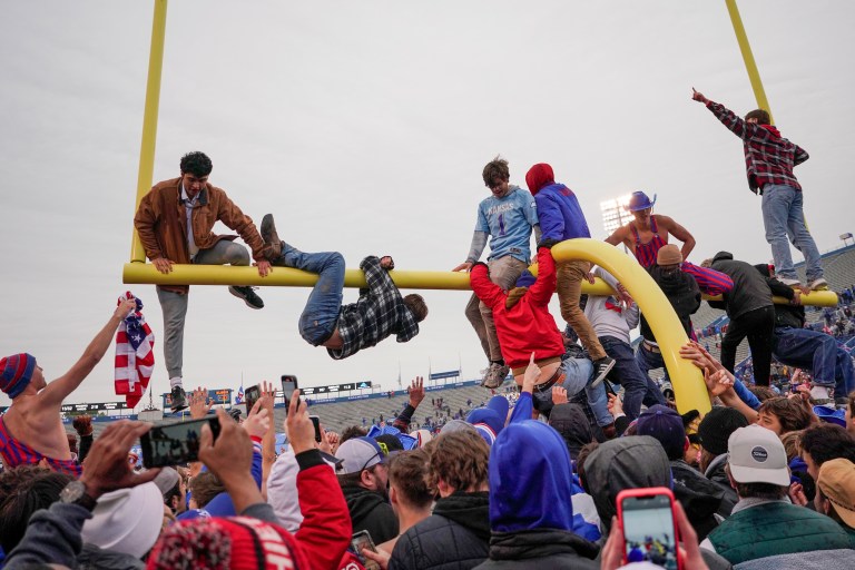 Kansas fans take goal posts for a swim following Oklahoma upset