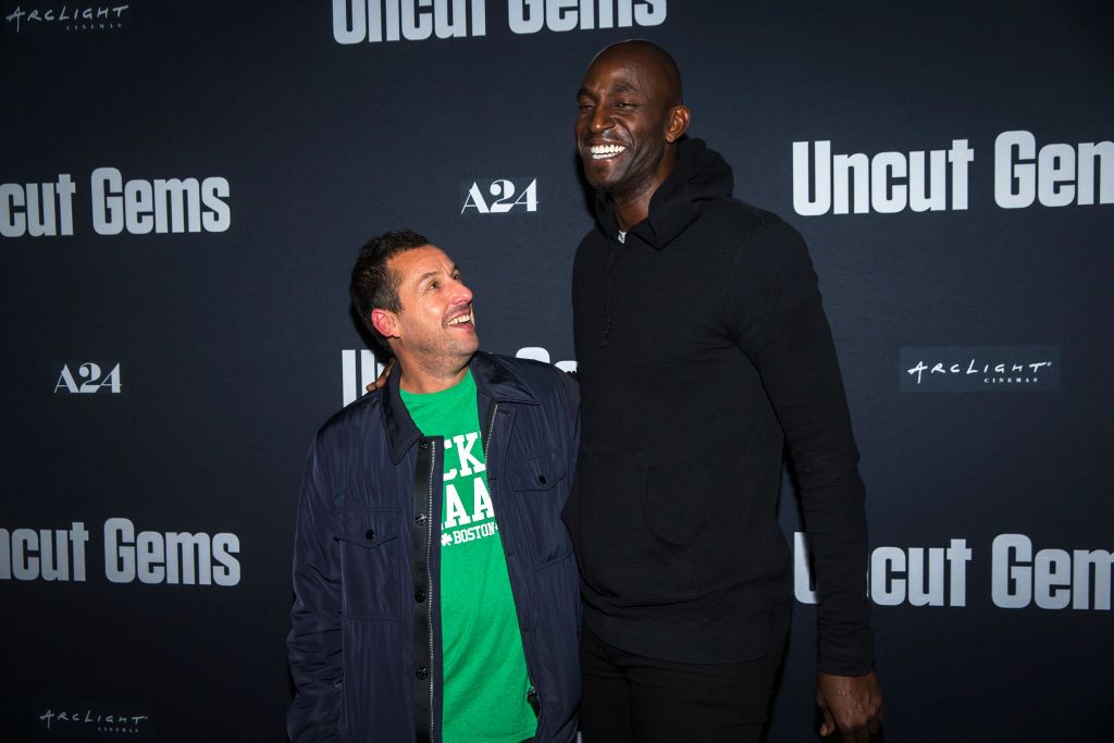 BOSTON, MA - DECEMBER 8: Actor/comedian Adam Sandler, left, and former Boston Celtics player Kevin Garnett laugh together before the special Q&A screening and reception for their new film "Uncut Gems" at ArcLight Cinemas in Boston on Dec. 8, 2019. Sandler stars with Garnett, who plays himself. (Photo by Nic Antaya for The Boston Globe via Getty Images)