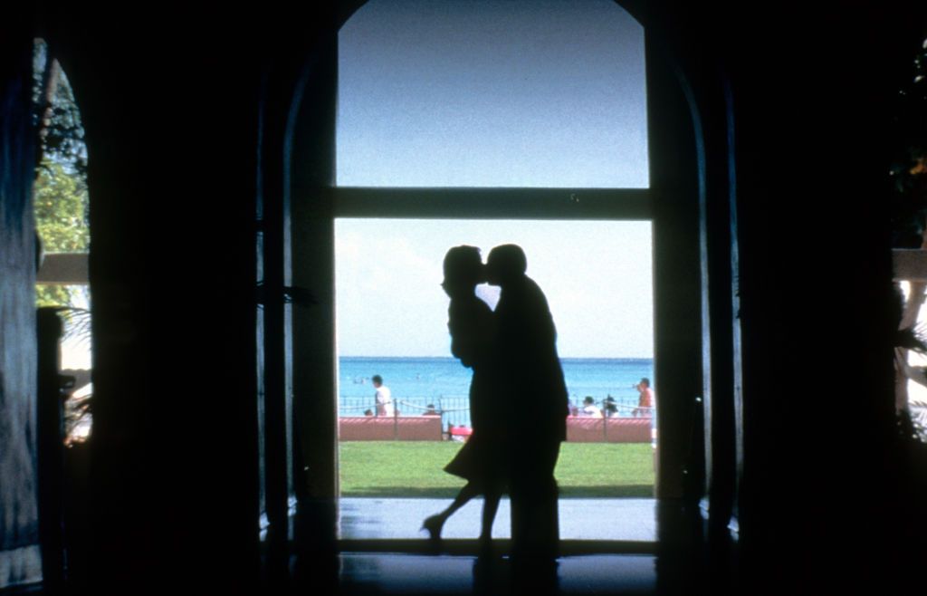 Emily Watson kisses Adam Sandler in a scene from the film 'Punch-Drunk Love', 2002. (Photo by Columbia Pictures/Getty Images)