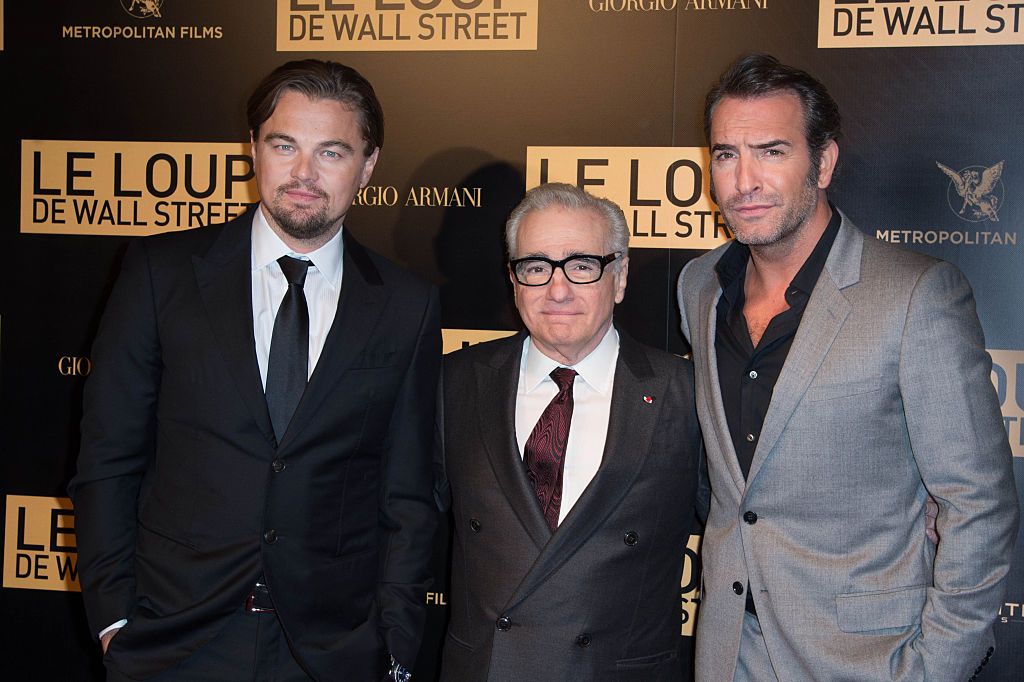 (L-R) Actor Leonardo DiCaprio, director Martin Scorsese and actor Jean Dujardin attend 'The Wolf of Wall Street' World Premiere at Cinema Gaumont Opera, in Paris. (Photo by Stephane Cardinale/Corbis via Getty Images)