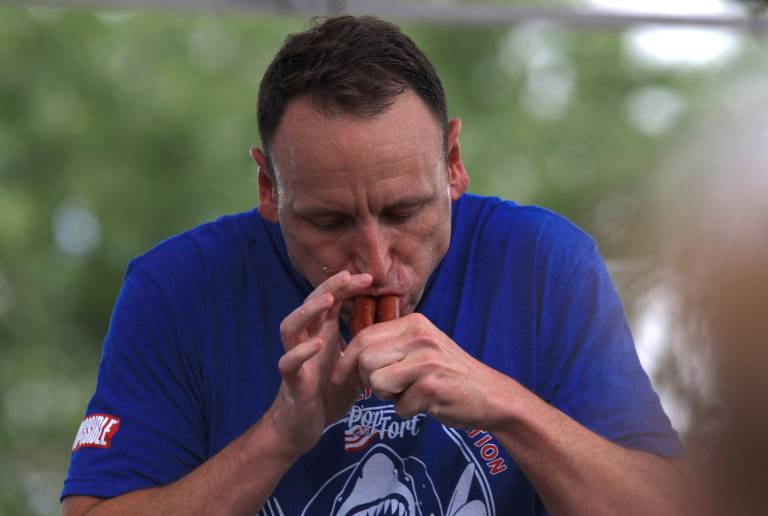 Joey Chestnut Devours World Record 83 Hot Dogs in Showdown with Kobayashi